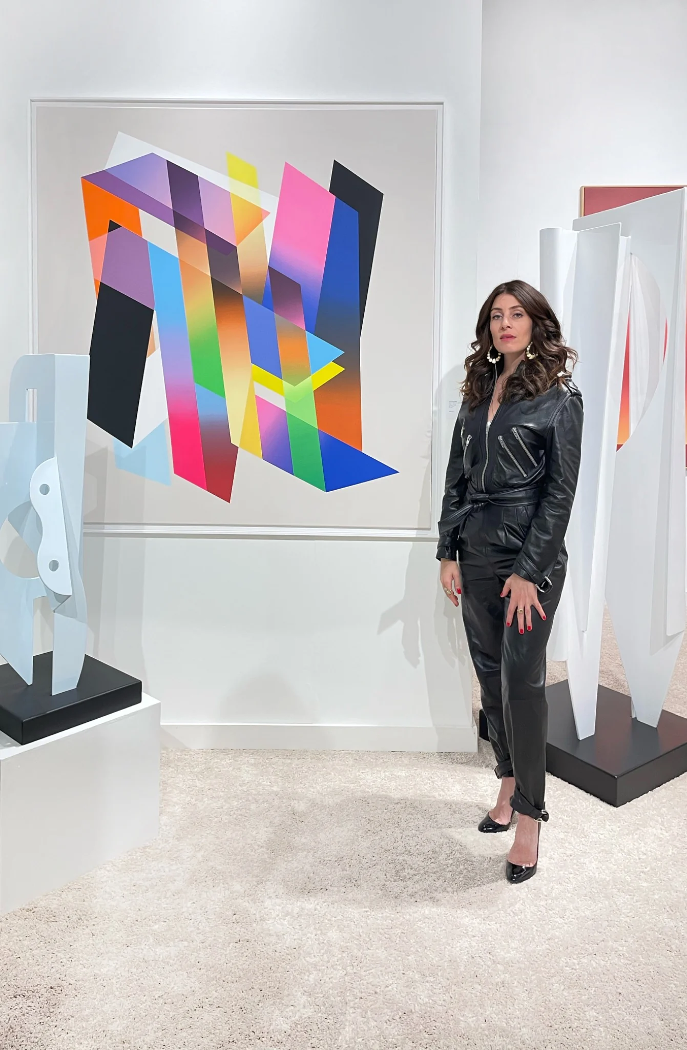 Art Miami presentation with geometric abstract works and sculpture