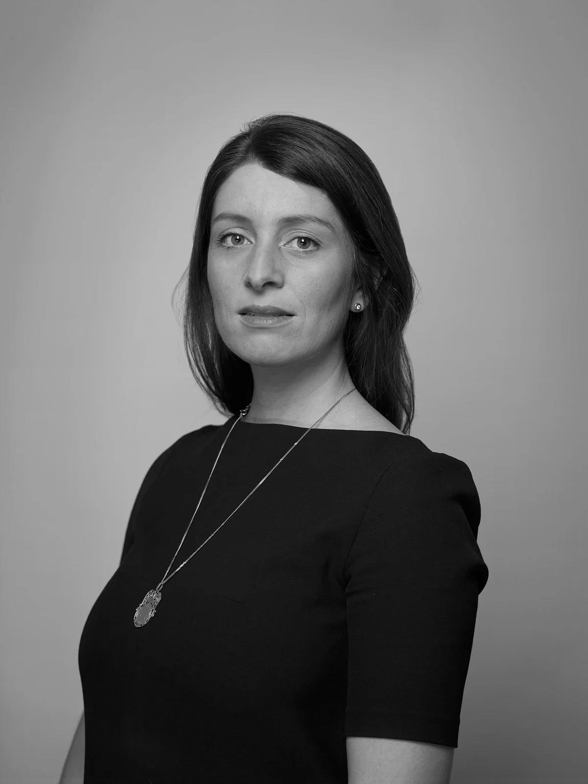 Black and white portrait of curator Laetitia Dufour